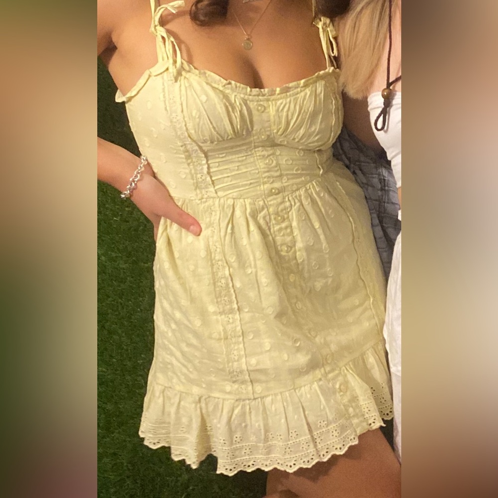 Yellow dress. Size small but very flexible so could fit many sizes